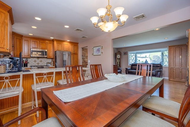 7 Gilmore Dr, Stony Point, NY 10980 - dining space featuring light wood-style floors, a chandelier, and recessed lighting