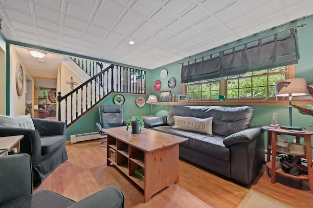 39 Bykenhulle Rd, Hopewell Junction, NY 12533 - living room featuring light wood finished floors, baseboard heating, stairway, and recessed lighting