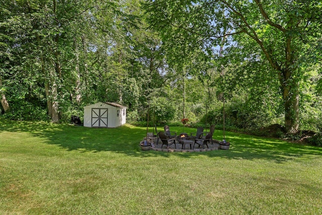 39 Bykenhulle Rd, Hopewell Junction, NY 12533 - view of green lawn featuring a fire pit and a storage unit