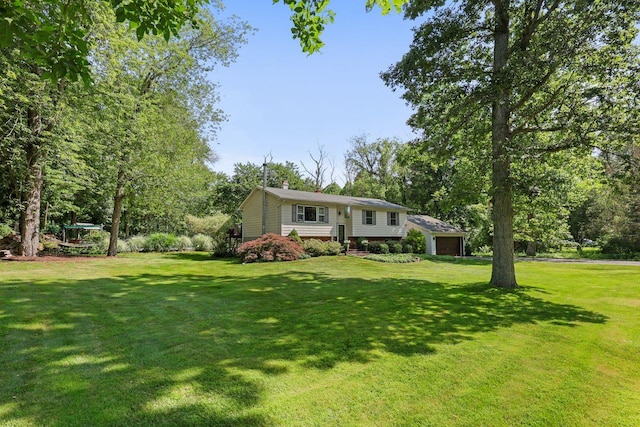 39 Bykenhulle Rd, Hopewell Junction, NY 12533 - view of grassy yard featuring an attached garage