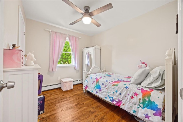 273 N Brewster Rd, Brewster, NY 10509 - bedroom featuring a baseboard heating unit, wood finished floors, and a ceiling fan