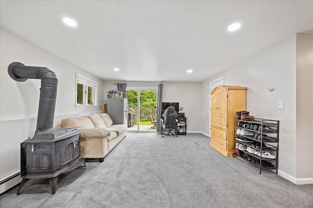 273 N Brewster Rd, Brewster, NY 10509 - living area featuring carpet floors, recessed lighting, baseboard heating, and a wood stove