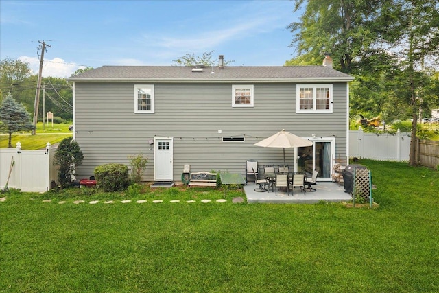273 N Brewster Rd, Brewster, NY 10509 - rear view of property with a patio, a chimney, and a fenced backyard