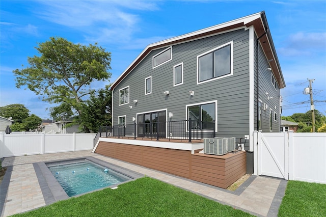 141 Flamingo St, Atlantic Beach, NY 11509 - rear view of house with a fenced backyard and a gate