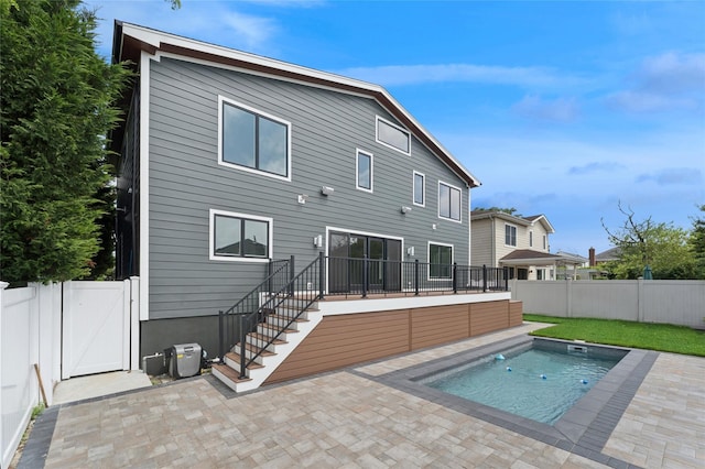 141 Flamingo St, Atlantic Beach, NY 11509 - back of house featuring a patio, a fenced backyard, and a gate
