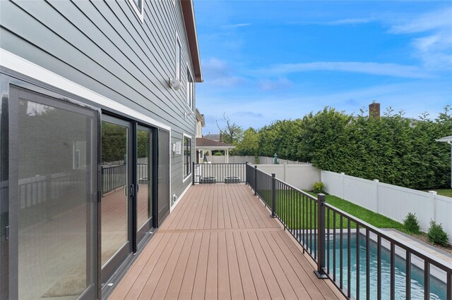 141 Flamingo St, Atlantic Beach, NY 11509 - wooden deck featuring a fenced backyard