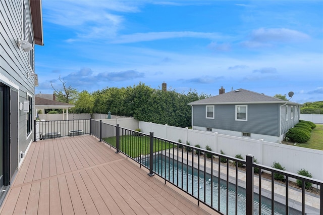 141 Flamingo St, Atlantic Beach, NY 11509 - wooden deck featuring a fenced backyard and an outdoor pool
