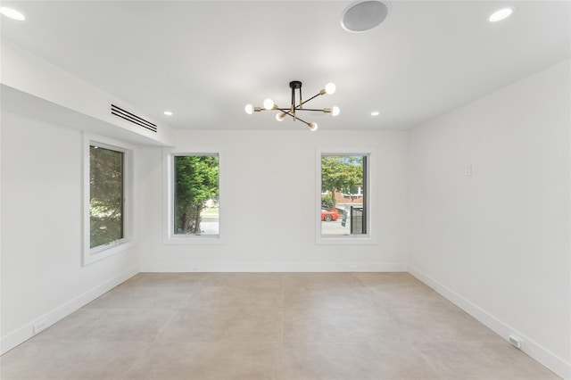 141 Flamingo St, Atlantic Beach, NY 11509 - unfurnished room featuring a chandelier, recessed lighting, and concrete flooring