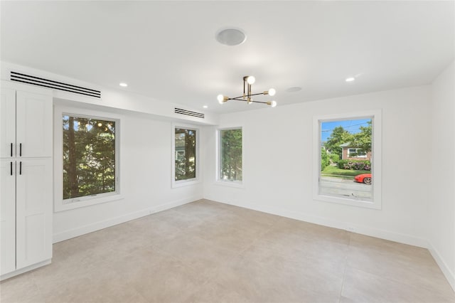 141 Flamingo St, Atlantic Beach, NY 11509 - unfurnished room featuring healthy amount of natural light, a chandelier, recessed lighting, and light tile patterned floors