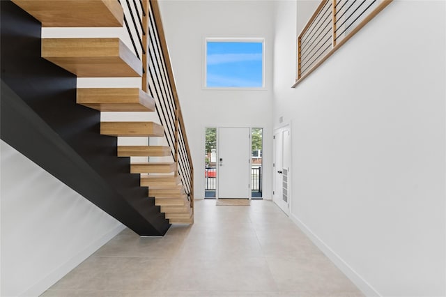 141 Flamingo St, Atlantic Beach, NY 11509 - entrance foyer featuring stairway and a towering ceiling