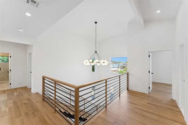 141 Flamingo St, Atlantic Beach, NY 11509 - hall with an upstairs landing, a chandelier, healthy amount of natural light, recessed lighting, and high vaulted ceiling