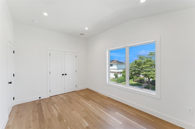 141 Flamingo St, Atlantic Beach, NY 11509 - unfurnished bedroom featuring light wood-type flooring, recessed lighting, and vaulted ceiling