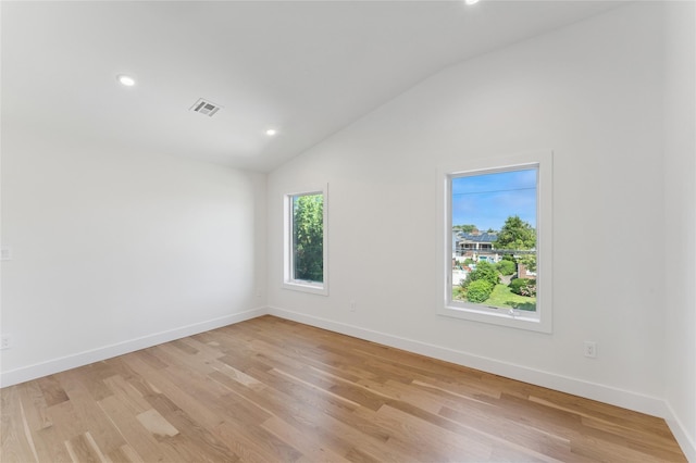 141 Flamingo St, Atlantic Beach, NY 11509 - spare room with lofted ceiling, light wood finished floors, and recessed lighting