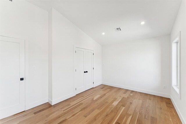 141 Flamingo St, Atlantic Beach, NY 11509 - unfurnished room featuring light wood-style flooring, lofted ceiling, and recessed lighting