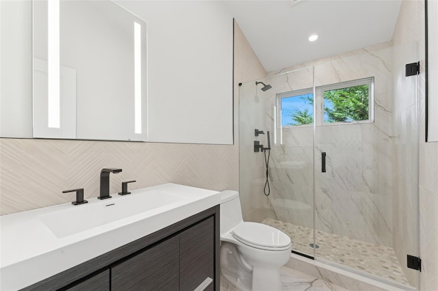 141 Flamingo St, Atlantic Beach, NY 11509 - bathroom with vanity, a marble finish shower, marble look tile flooring, and tile walls
