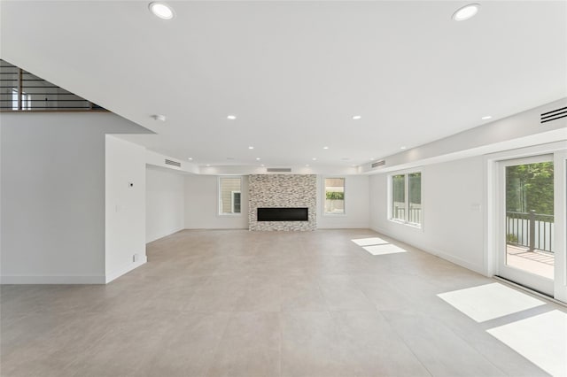 141 Flamingo St, Atlantic Beach, NY 11509 - unfurnished living room with plenty of natural light, recessed lighting, and a large fireplace