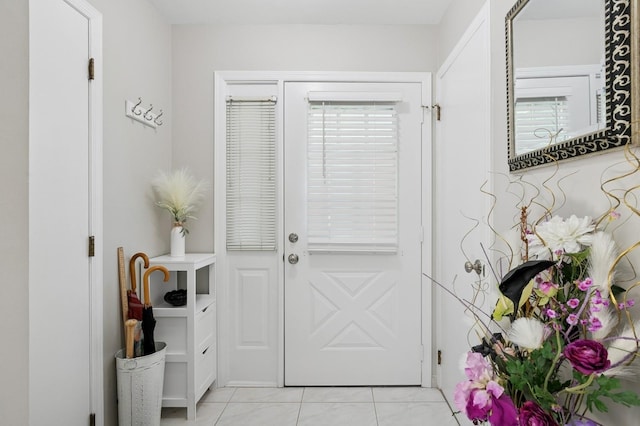 27 Primrose Ln, North Babylon, NY 11703 - doorway to outside with light tile patterned flooring
