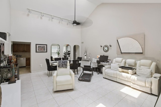 27 Primrose Ln, North Babylon, NY 11703 - living area featuring high vaulted ceiling, light tile patterned floors, track lighting, and ceiling fan