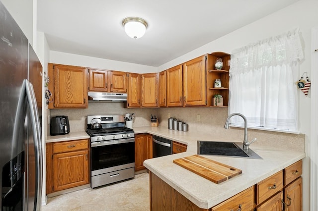 27 Primrose Ln, North Babylon, NY 11703 - kitchen with appliances with stainless steel finishes, under cabinet range hood, brown cabinetry, and light countertops