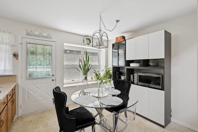 27 Primrose Ln, North Babylon, NY 11703 - dining area with a chandelier