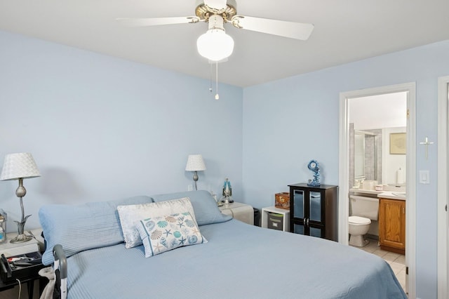 27 Primrose Ln, North Babylon, NY 11703 - bedroom with light tile patterned flooring, connected bathroom, and a ceiling fan