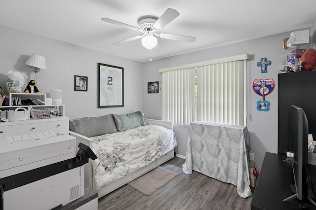 27 Primrose Ln, North Babylon, NY 11703 - bedroom featuring wood finished floors and a ceiling fan