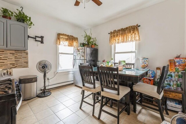 4808 92nd St, Elmhurst, NY 11373 - dining room with a ceiling fan, light tile patterned floors, and baseboard heating