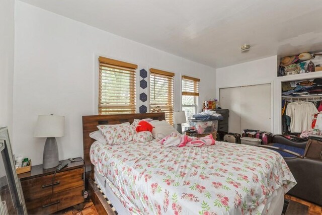 4808 92nd St, Elmhurst, NY 11373 - bedroom featuring two closets and wood finished floors