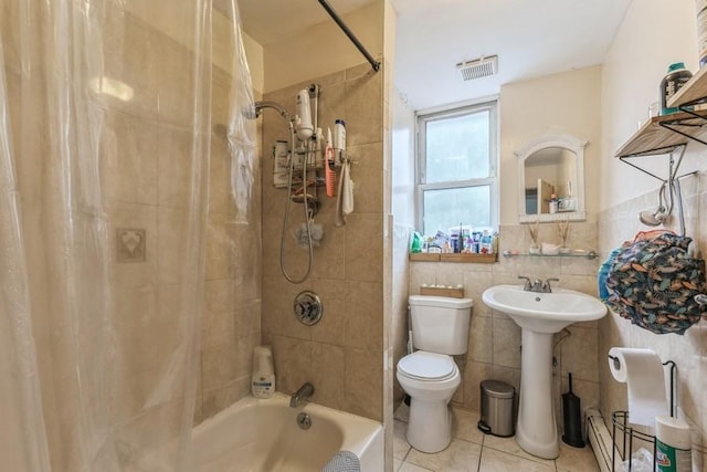 4808 92nd St, Elmhurst, NY 11373 - bathroom featuring tile walls, tile patterned flooring, shower / bath combo, and a baseboard radiator