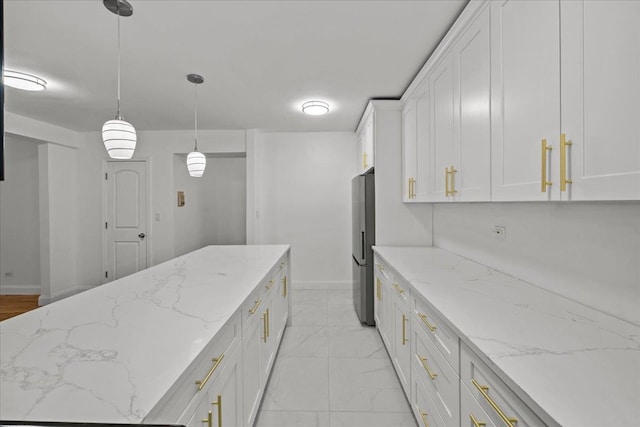 2107 Wallace Ave Unit 4G, Bronx, NY 10462 - kitchen featuring freestanding refrigerator, white cabinetry, light marble finish flooring, pendant lighting, and light stone counters