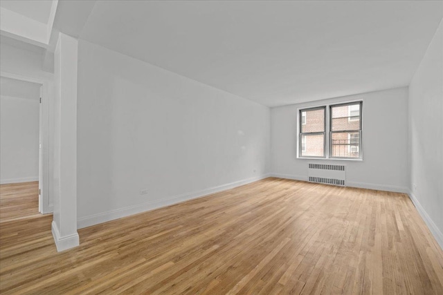 2107 Wallace Ave Unit 4G, Bronx, NY 10462 - unfurnished room featuring radiator heating unit and light wood-style flooring