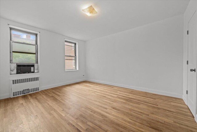 2107 Wallace Ave Unit 4G, Bronx, NY 10462 - spare room with radiator, cooling unit, and light wood finished floors