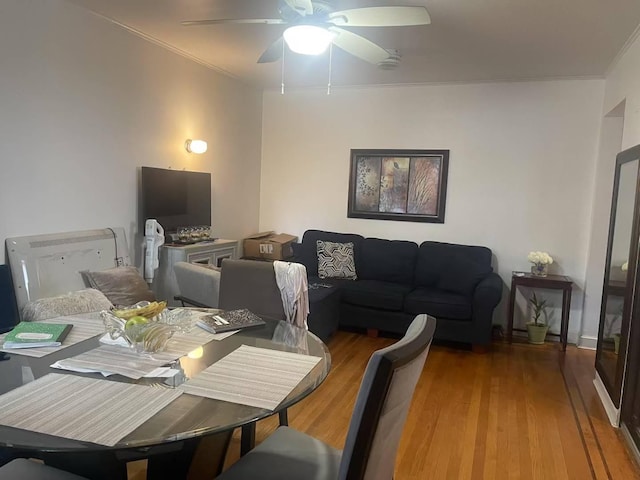 20-39 150th St, Whitestone, NY 11357 - dining space with ceiling fan, light wood-style floors, and ornamental molding