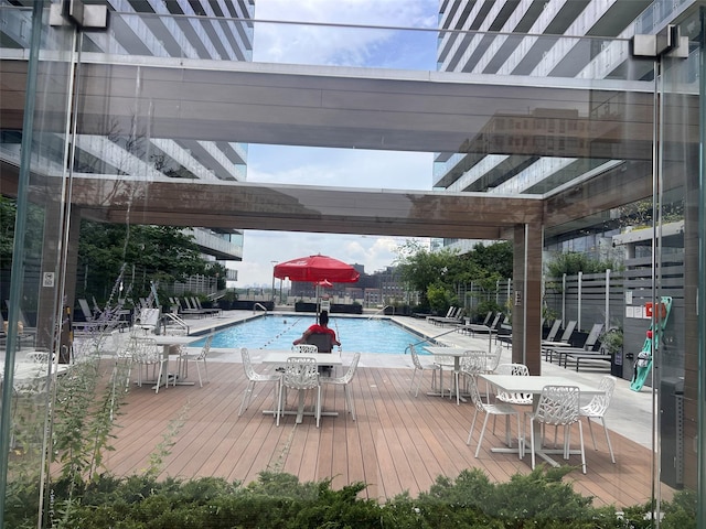 131-05 40th Rd Unit 17T, Flushing, NY 11354 - community pool with a deck and outdoor dining area