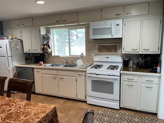 39 Herbert Ave, Lindenhurst, NY 11757 - kitchen with white appliances, light tile patterned floors, light countertops, white cabinetry, and recessed lighting