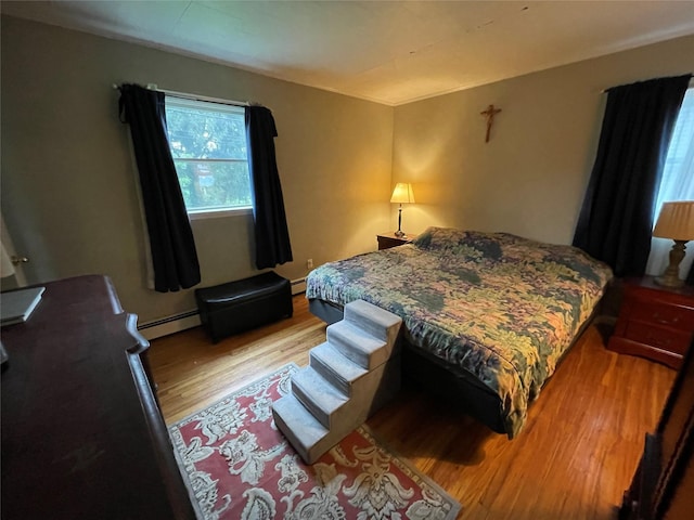 39 Herbert Ave, Lindenhurst, NY 11757 - bedroom with a baseboard radiator and light wood-style floors