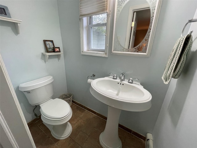 39 Herbert Ave, Lindenhurst, NY 11757 - half bathroom featuring toilet and tile patterned flooring