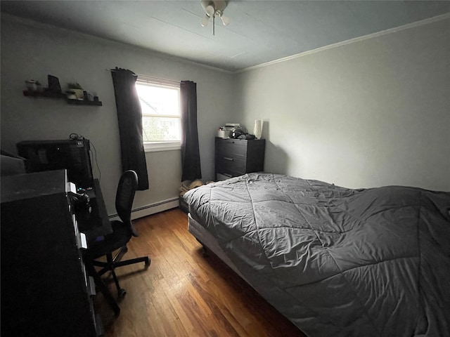 39 Herbert Ave, Lindenhurst, NY 11757 - bedroom featuring wood finished floors, ornamental molding, a baseboard radiator, a desk, and a ceiling fan