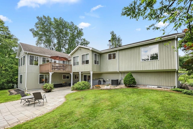 9 Carol Ct, Brewster, NY 10509 - rear view of property featuring a patio, a lawn, and a deck