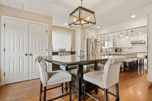 9 Carol Ct, Brewster, NY 10509 - dining area featuring a chandelier, light wood-type flooring, and recessed lighting