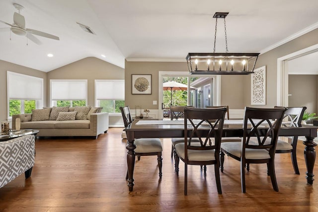 9 Carol Ct, Brewster, NY 10509 - dining space with vaulted ceiling, plenty of natural light, a ceiling fan, crown molding, and dark wood-style floors