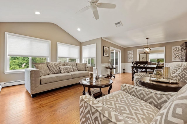 9 Carol Ct, Brewster, NY 10509 - living area with light wood finished floors, a wainscoted wall, a ceiling fan, plenty of natural light, and vaulted ceiling