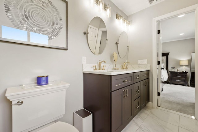 9 Carol Ct, Brewster, NY 10509 - ensuite bathroom with double vanity, marble finish flooring, and crown molding