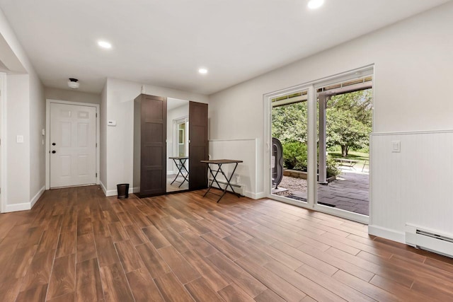 9 Carol Ct, Brewster, NY 10509 - unfurnished room featuring dark wood-style flooring, a baseboard radiator, and recessed lighting