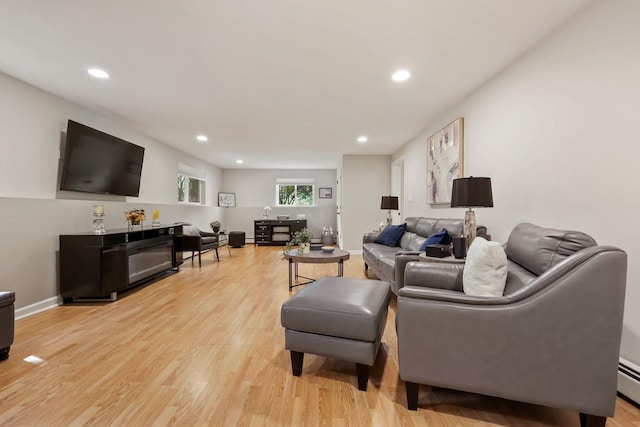 9 Carol Ct, Brewster, NY 10509 - living area featuring light wood finished floors, recessed lighting, and a baseboard radiator
