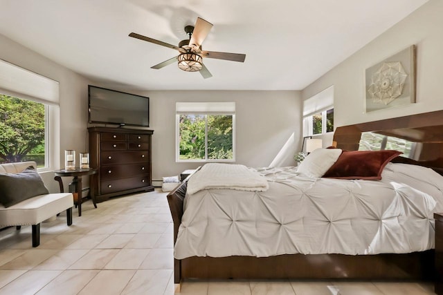 9 Carol Ct, Brewster, NY 10509 - bedroom featuring multiple windows, light tile patterned floors, and a ceiling fan