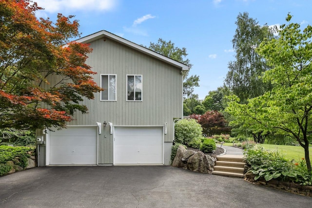 9 Carol Ct, Brewster, NY 10509 - view of home's exterior featuring driveway and a garage
