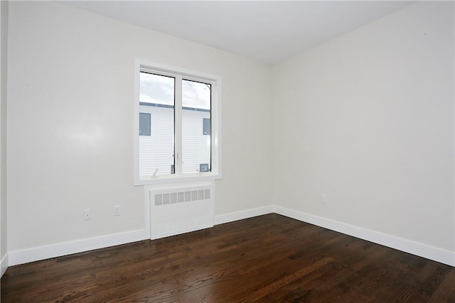 33 Ewing Ave Unit 102, Spring Valley, NY 10977 - unfurnished room with radiator heating unit and dark wood-type flooring