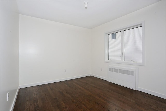 33 Ewing Ave Unit 102, Spring Valley, NY 10977 - unfurnished room featuring radiator heating unit and dark wood-type flooring
