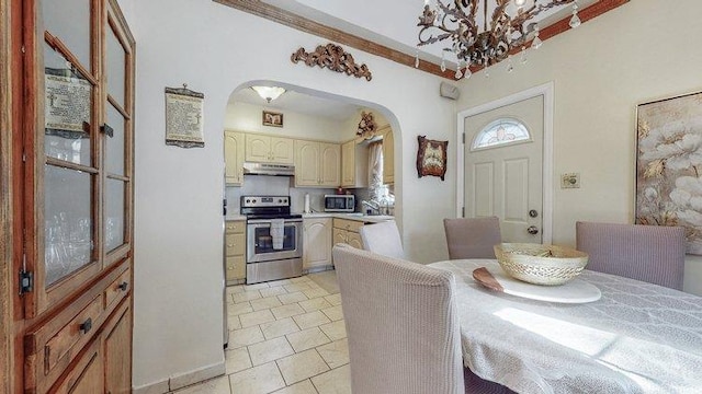 46-03 195th St, Flushing, NY 11358 - dining area featuring arched walkways, a chandelier, and light tile patterned floors